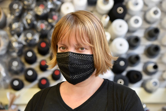 Lavender Tessmer wearing a fitted, black mask with active fibers