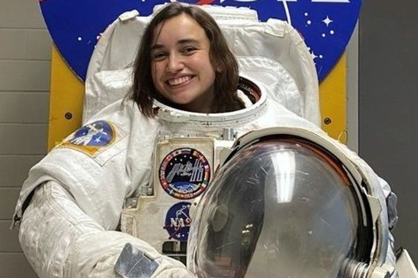 Katherine Brennan wearing a spacesuit 