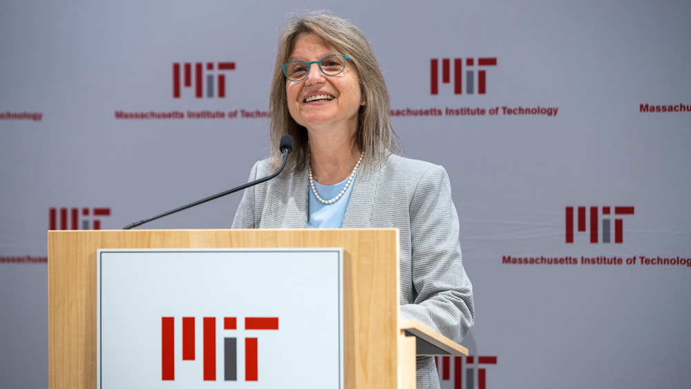 Sally Kornbluth at a podium speaking to an audience