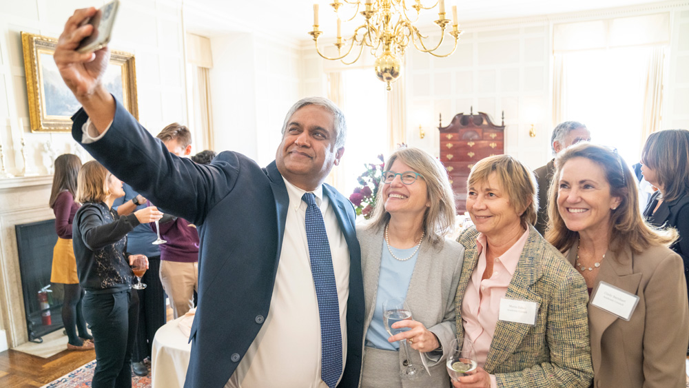 Sally Kornbluth with three MIT faculty members while one of them takes a selfie