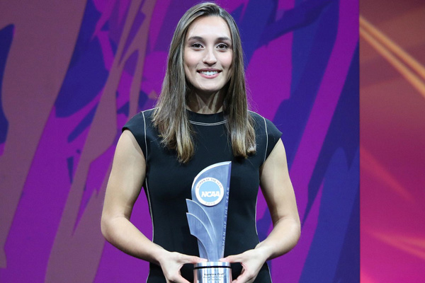 Karenna Groff holding an NCAA trophy