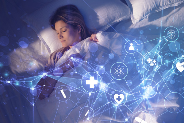 A person sleeping with monitoring iconography overlaying the bed