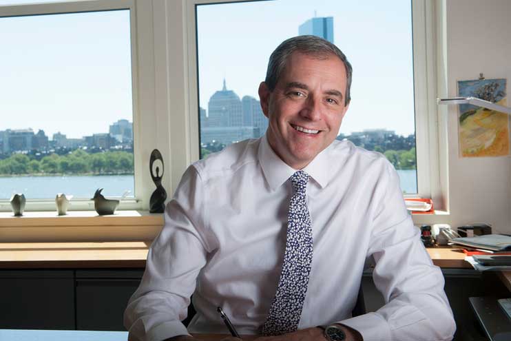 David Autor portrait inside an office with window in background