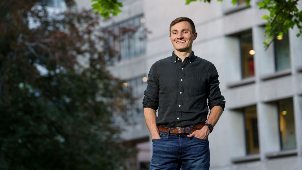 Aaron Berman portrait outside on campus