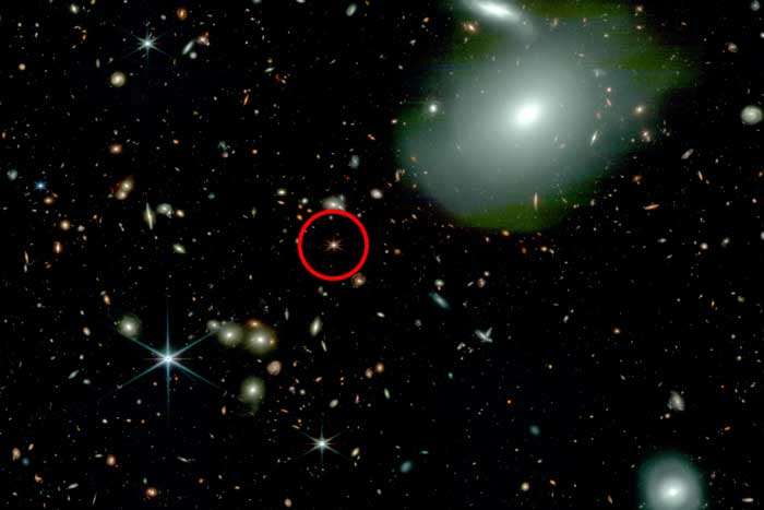 1000s of galaxies appear as tiny bright lights, and one is circled in red.