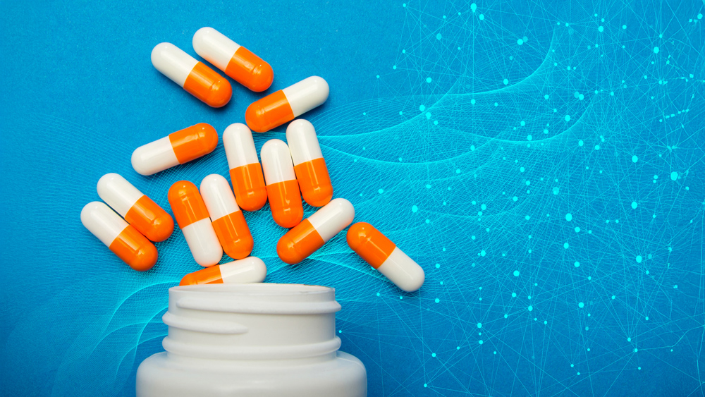 Pills on futuristic background