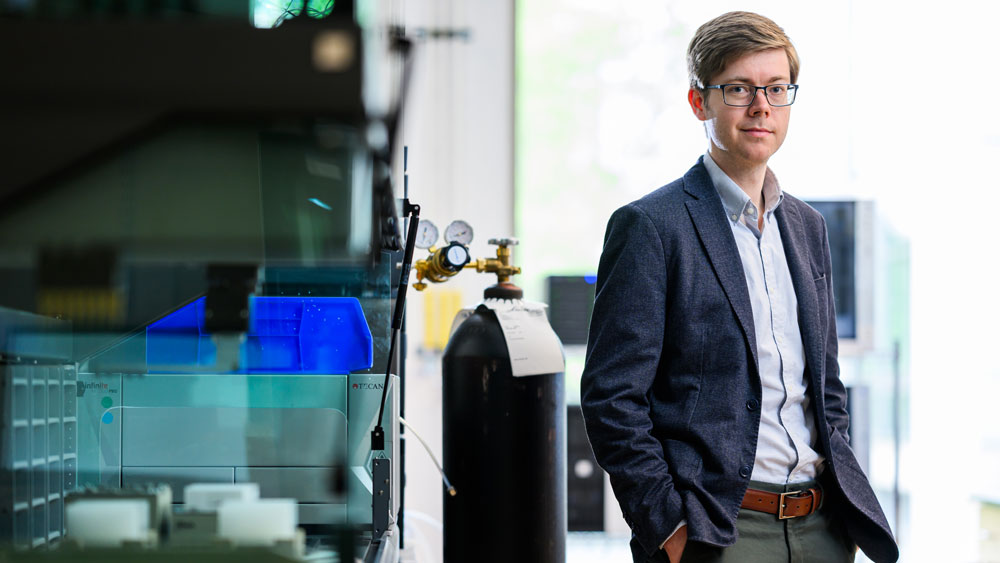 Conor Coley standing in lab