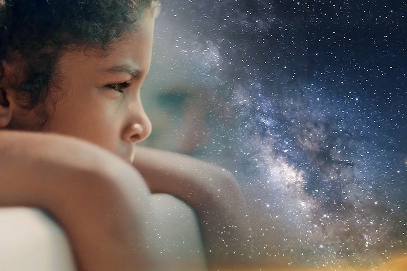 thoughtful girl and a galaxy