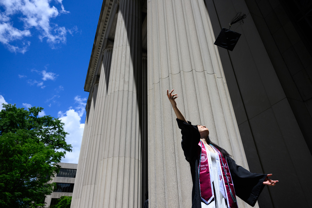 grad throws hat in the air