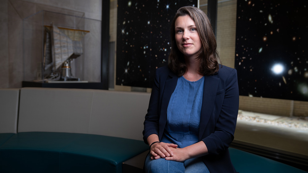 Erin Kara portrait with galaxy poster in background