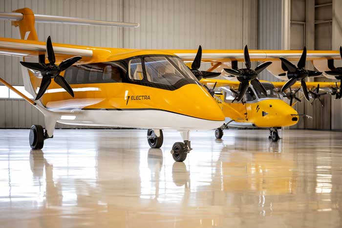 yellow electric airplanes in hangar