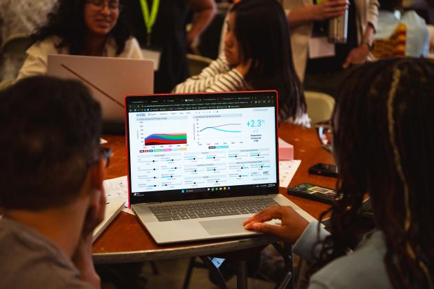 Undergraduate students explore the En-ROADS climate simulator.