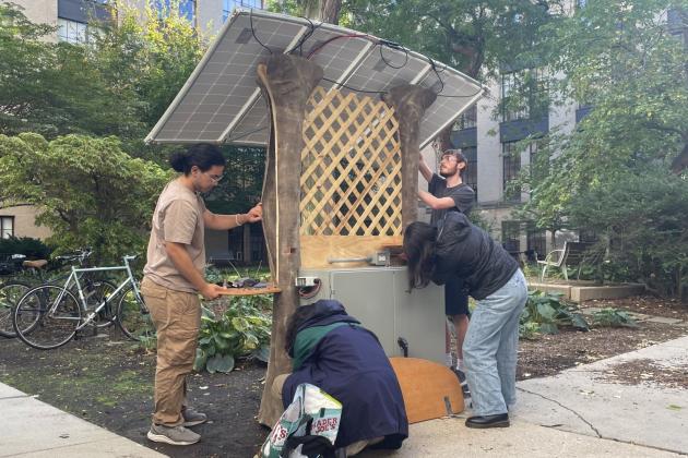 NEET scholars install their team's solar-powered charging station in an MIT campus courtyard as part of 22.03/3.0061 (Introduction to Design Thinking and Rapid Prototyping), a class offered through the NEET Climate and Sustainability Systems thread.