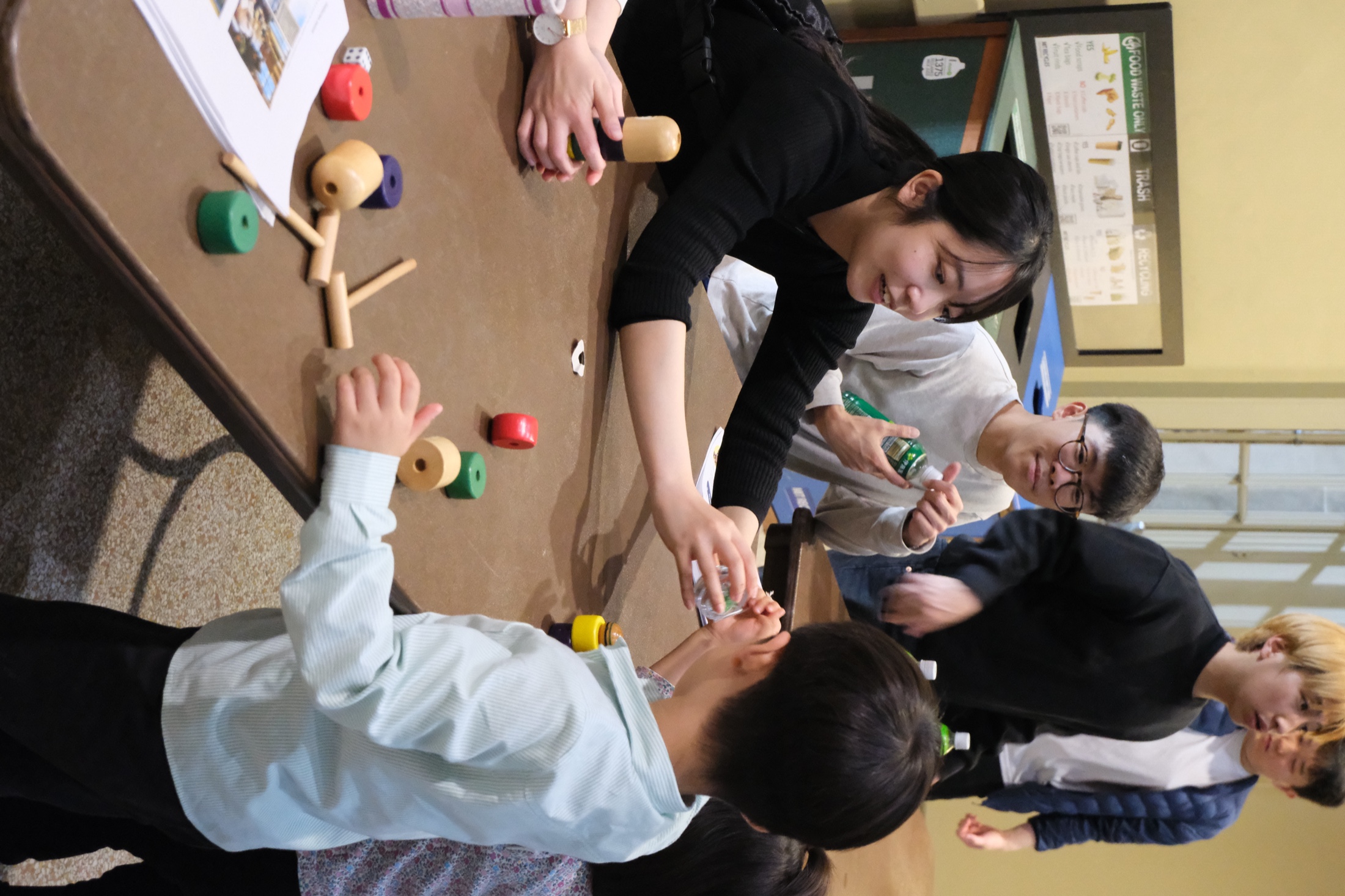 A busy Hanami Festival table inside Walker Memorial