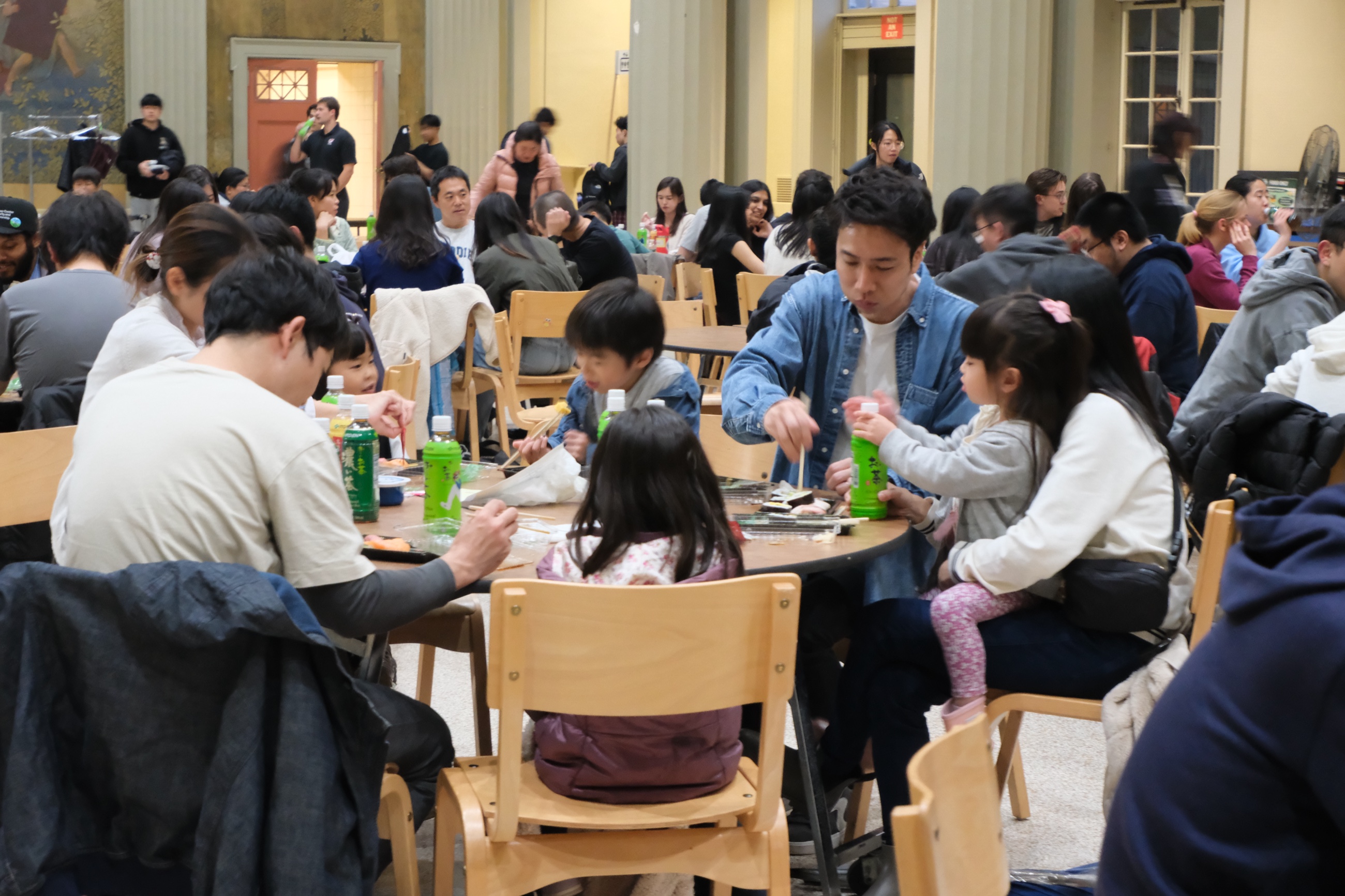 A large Hanami Festival crowd gathered inside Walker Memorial