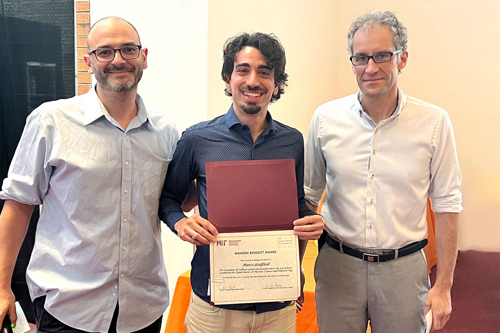 Marco Graffiedi in the center holding an award certificte with Matteo Buccito the left and Jacopo Buongiorno to the right, in a row, MIT