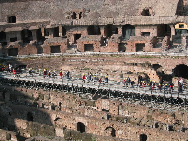 The Tourist Mob crosses the Colosseum