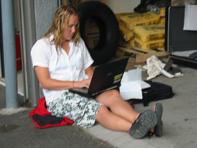 Candace relaxes on the floor while entering one day's data. 