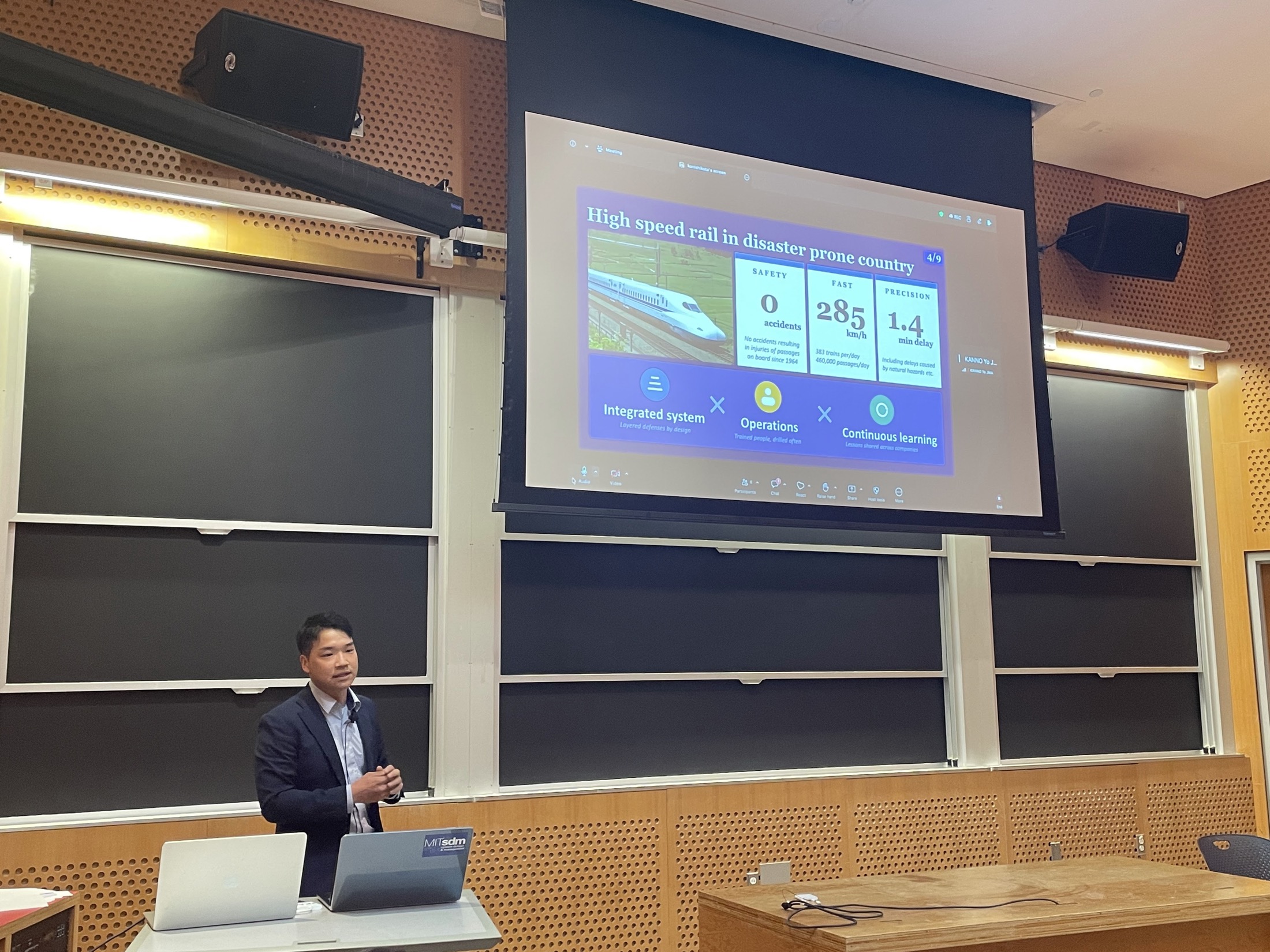 Speaker presenting disaster resilience topics at MIT